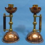 A pair of Arts and Crafts Christopher Dresser-style Candlesticks, of copper and brass, with wooden