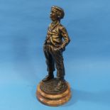 After Moreau; a Bronze figure of a Boy Whistling, with signature, mounted on circular marble plinth