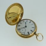 An 18ct gold Hunter Pocket Watch, key wound, the white enamel dial with black Roman numerals and