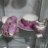 An early 20thC Staffordshire Tea Service, the pink ground, decorated with gilding, with factory mark