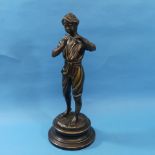 After Baccini; a Bronze figure of a Piper Boy raised on a circular plinth,