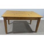 A vintage pine Kitchen Table, the planked top above single frieze drawer, raised on square