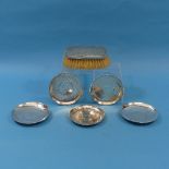 A collection of five early 20thC Oriental silver circular Dishes, all inset with coins, two with