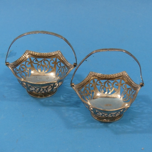 A pair of George V silver swing handled Bon Bon Dishes, by Charles Edwards, hallmarked London, 1915,