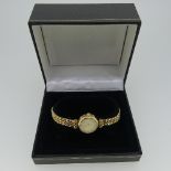 A 9ct yellow gold lady's Accurist Wrist Watch, with quartz movement, on a flexible 9ct gold