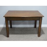 A 1920s oak Table, with beaded edge, raised on square tapering legs, 34in (86cm) wide x 48in (122cm)