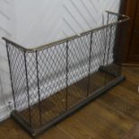 A Victorian brass and metal Nursery Spark Guard/Fender, with bowed shaped design with trellis mesh