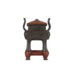 A CHINESE BRONZE 'TAOTIE' INCENSE BURNER.