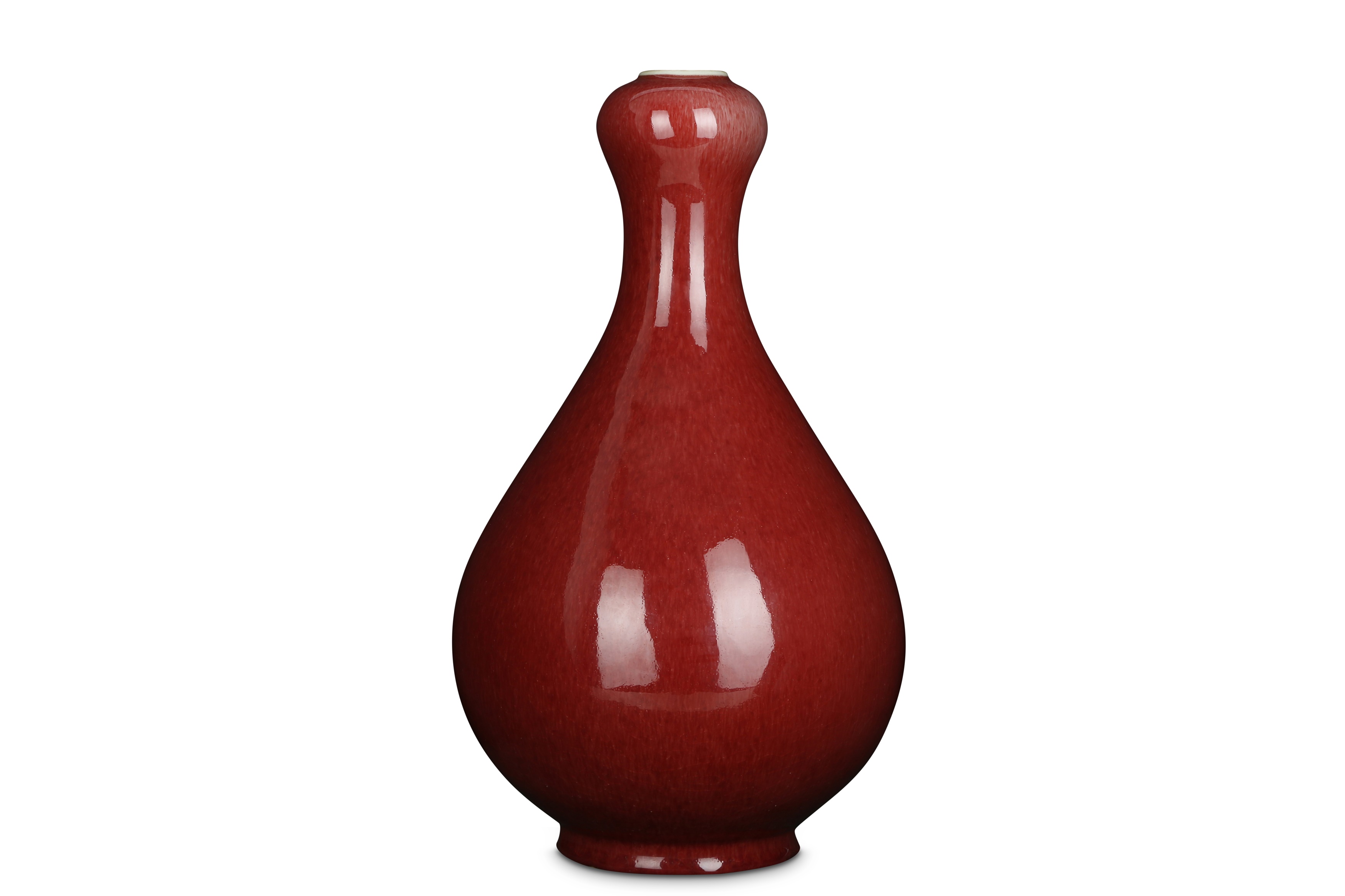 A CHINESE COPPER RED-GLAZED GARLIC MOUTH VASE.