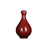 A CHINESE COPPER RED-GLAZED GARLIC MOUTH VASE.