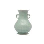 A CHINESE CELADON-GLAZED VASE, HU.