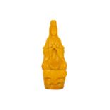 A CHINESE BEIJING YELLOW GLASS FIGURE OF GUANYIN.