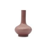 A CHINESE COPPER-RED GLAZED BOTTLE VASE.