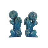 A PAIR OF JAPANESE TURQUOISE-GLAZED LION DOGS.