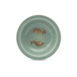 A CHINESE CELADON 'DOUBLE FISH' SAUCER.