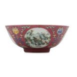 A CHINESE FAMILLE ROSE RUBY-GROUND MEDALION BOWL.