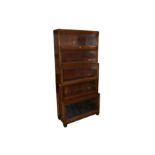 A GLOBE WERNIKCE 'CLASSIC' FIVE TIER WALNUT SECTIONAL STACKING WATERFALL BOOKCASE