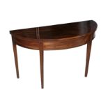 A GEORGE III MAHOGANY DEMI-LUNE TEA TABLE,