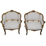 A PAIR OF FRENCH LOUIS XVI STYLE CARVED GILTWOOD SALON CHAIRS