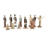 THIRTEEN POLYCHROME-PAINTED WOODEN FIGURINES