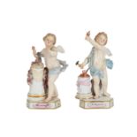 TWO MEISSEN ‘DEVISENKINDER’ OR MOTTO CHILDREN MODELLED AFTER MICHAEL VICTOR ACIER