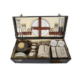 A CASED 'CORACLE' PICNIC SET FOR FOUR BY G W SCOTT & SONS, CIRCA 1920