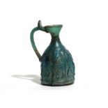 A BLUE MOULD-BLOWN GLASS FLASK ISLAMIC PERIOD, CIRCA 9TH - 10TH CENTURY A.D.