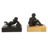 A PATINATED BRONZE FIGURE OF A SEATED BOY, 19TH CENTURY