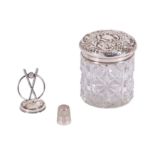 AN EDWARDIAN DRESSING TABLE JAR WITH A STERLING SILVER LID