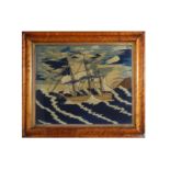 A WOOLWORK PICTURE OF A FRIGATE IN A STORMY SEA,19TH CENTURY,