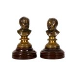 A PAIR OF FRENCH PATINATED BRONZE MINIATURE BUSTS OF INFANTS, LATE 19TH TO EARLY 20TH CENTURY