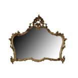 A ROCOCO STYLE GILT FRAMED OVERMANTEL MIRROR