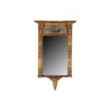 AN EARLY 19TH CENTURY GILT PIER MIRROR, WITH A REVERSE PAINTED GLASS PANEL