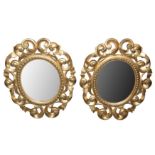 A PAIR OF ITALIAN FLORENTINE FRAME OVAL GILT WOOD MIRRORS, LATE 19TH/ EARLY 20TH CENTURY