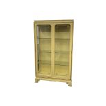 A CREAM LACQUERED AND GLASS RECTANGULAR DISPLAY CABINET, 20TH CENTURY