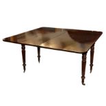 A GEORGE IV MAHOGANY DINING TABLE