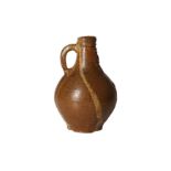 A GERMAN BROWN STONEWARE SALTGLAZED BELLARMINE LATE 17TH CENTURY