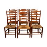 A SET OF FIVE COTSWOLD SCHOOL YEW WOOD LADDER BACK DINING CHAIRS BY EDWARD GARDINER