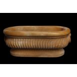 A LARGE NEO-CLASSICAL STYLE CARVED STONE WINE COOLER / BASIN
