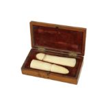 A 19TH CENTURY ENGLISH CARVED IVORY PHALLUS IN MAHOGANY CASE