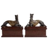 A PAIR OF LATE 18TH CENTURY ITALIAN BRONZE MODELS OF GREYHOUNDS WITH THE SAN VITALE CREST