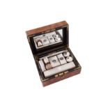 A Victorian sterling silver fitted burr walnut gentleman’s travelling vanity case, London 1861 by