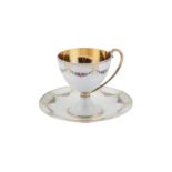 An early 20th century Norwegian 930 standard silver gilt and guilloche enamel cup and saucer,