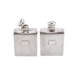 A pair of Edwardian/George V Art Deco sterling silver mounted glass cologne or scent bottles,