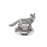 A modern cast unmarked silver model of a fox