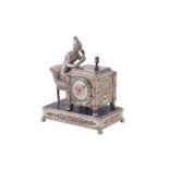 An early 20th century Austrian unmarked silver and champlevé enamel figural table timepiece,