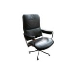 IN THE MANNER OF EAMES, A STEEL AND LEATHER UPHOLSTERED SWIVEL DESK CHAIR