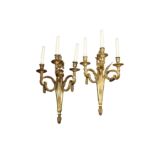 A PAIR OF FRENCH BRONZE THREE LIGHT WALL APPLIQUES, IN THE LOUIS XVI STYLE, 20TH CENTURY
