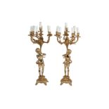 A PAIR OF GILT METAL SEVEN LIGHT CANDELABRA IN LOUIS XV STYLE