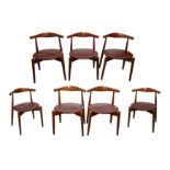 A SET OF SEVEN TEAK DINING CHAIRS